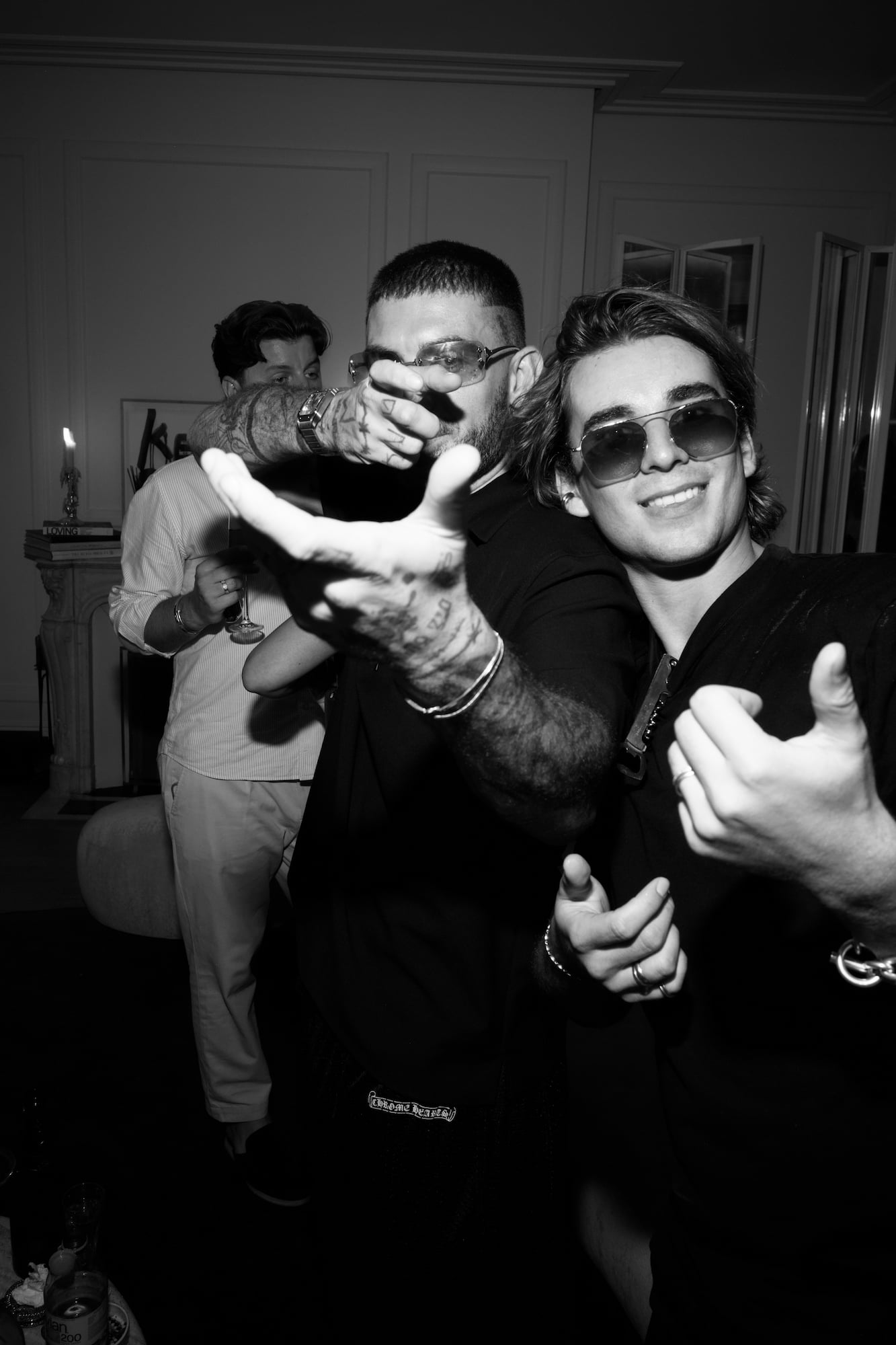 Two guests posing playfully for the camera during the party.