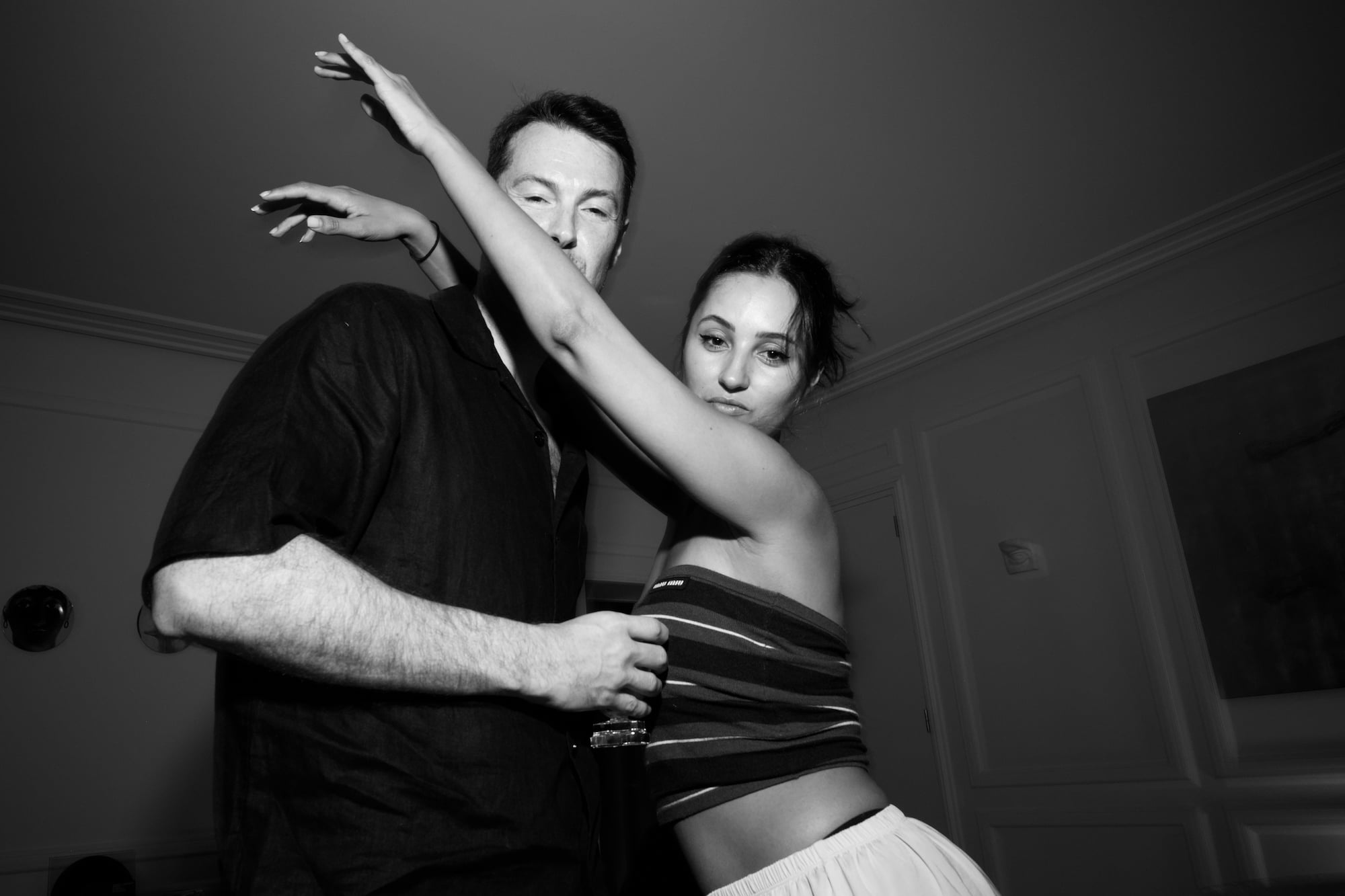 Couple posing together on the dance floor during the party.