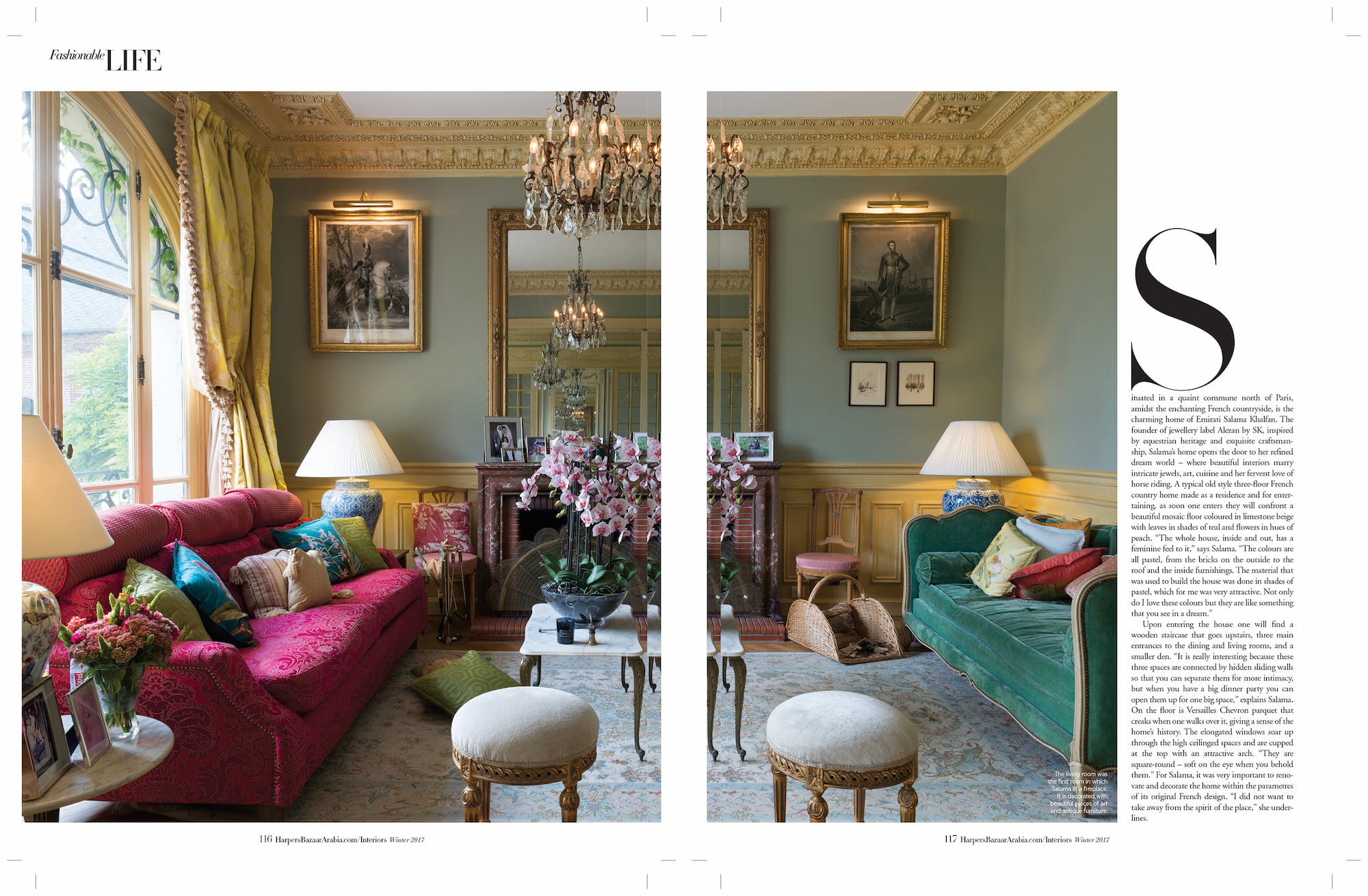 Living room in Salama Khalfan’s country house with colorful sofas, chandeliers, mirrors, and antique furnishings