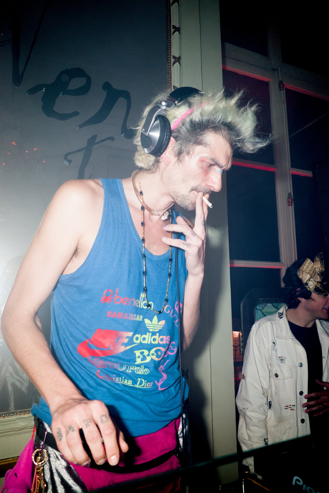 DJ smoking at stylish nightclub party