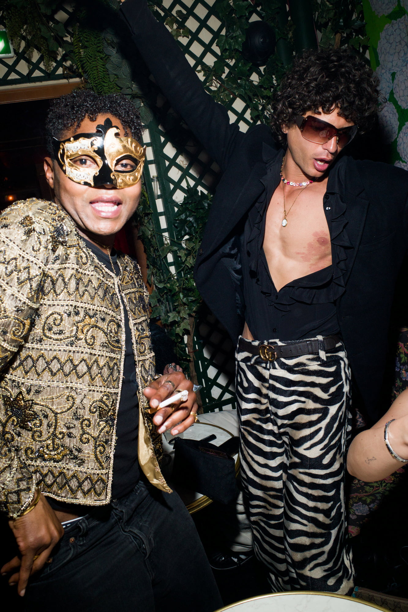 Fashionable guests dancing in ornate venue